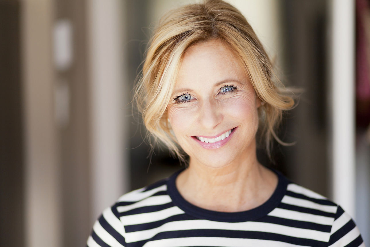 Mature woman smiling; Shutterstock ID 193110968