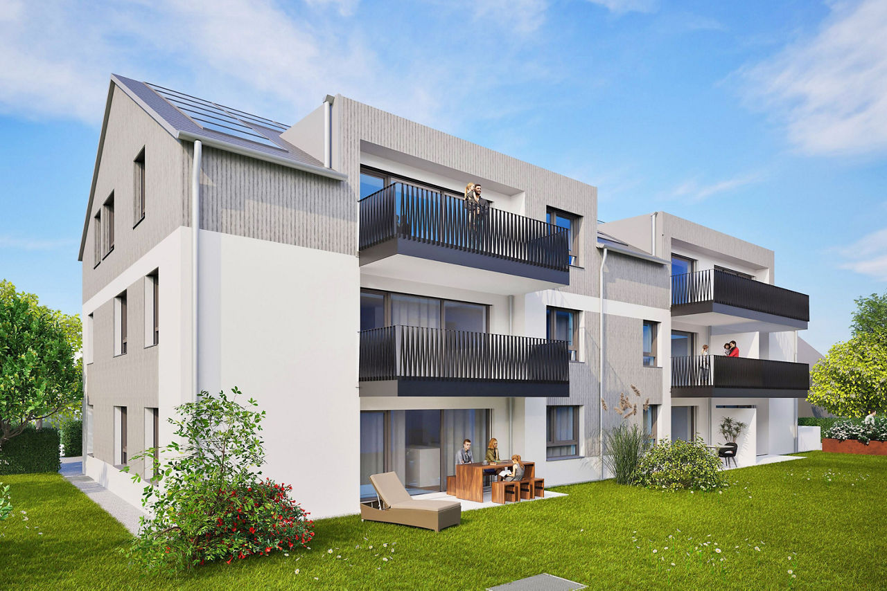 Modernes Mehrfamilienhaus mit Balkonen und begrüntem Außenbereich.