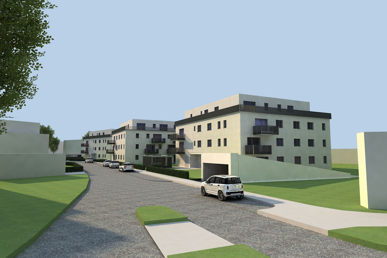 Straßenansicht einer modernen Wohnanlage mit drei Mehrfamilienhäusern, Balkonen, Grünflächen und mehreren Fahrzeugen entlang der Zufahrt.