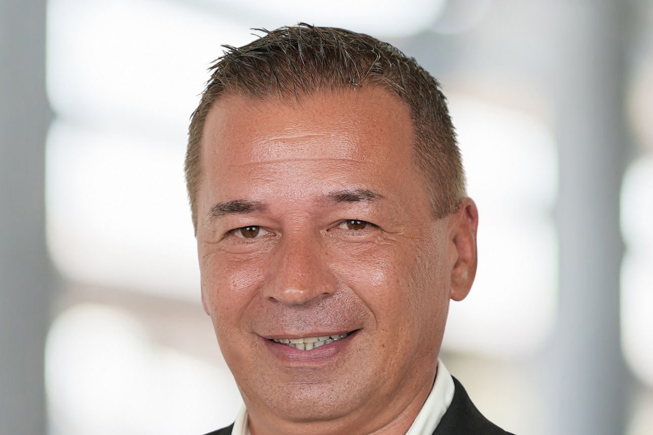Private Banking Ansprechpartner Robert Preugschat. Ein Mann im Anzug.