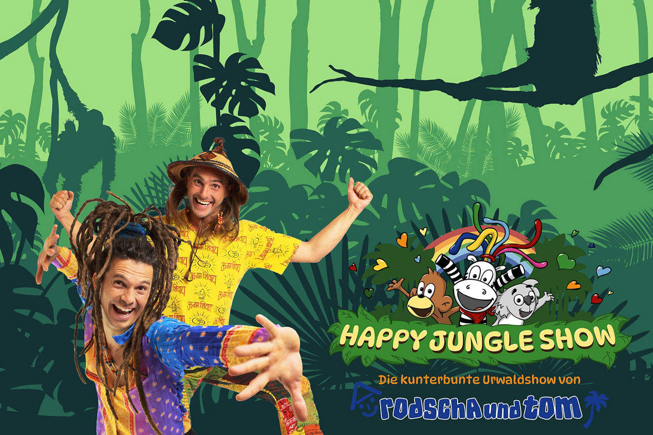 Rodscha und Tom stehen in bunten Klamotten im Dschungel.