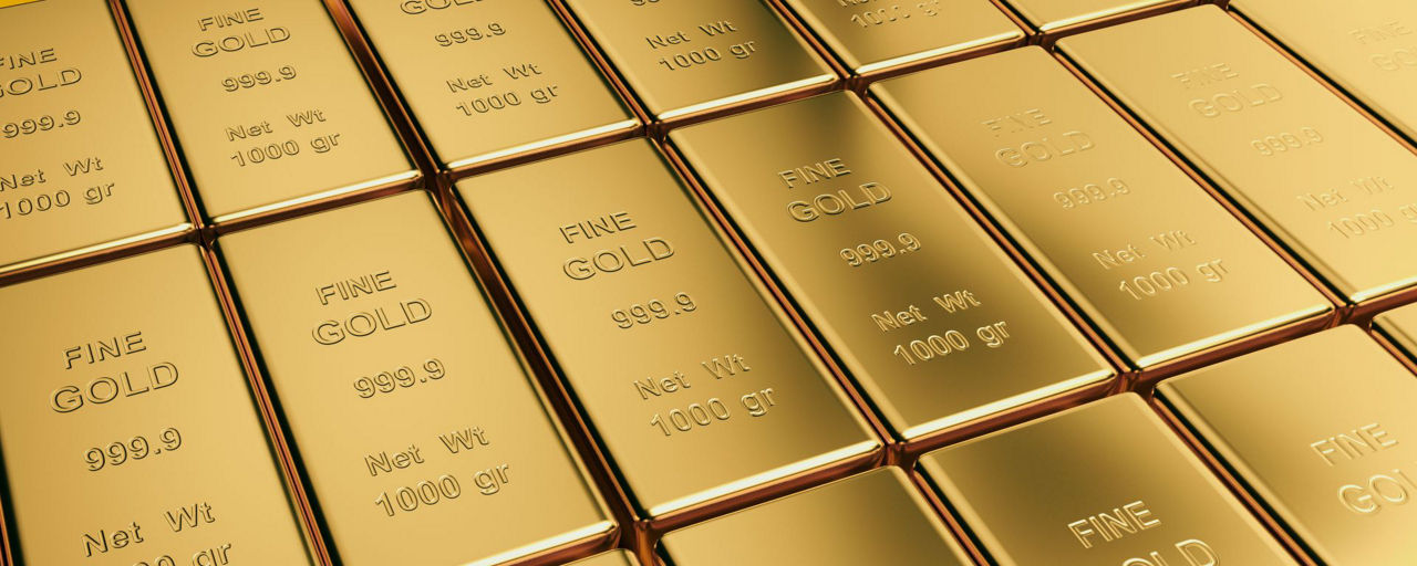 Das Bild zeigt mehrere Goldbarren. 