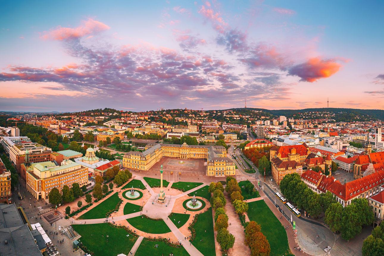 Aerial panoramic view of the famous Schlossplatz in Downtown Stuttgart, Germany at sunset, travel background