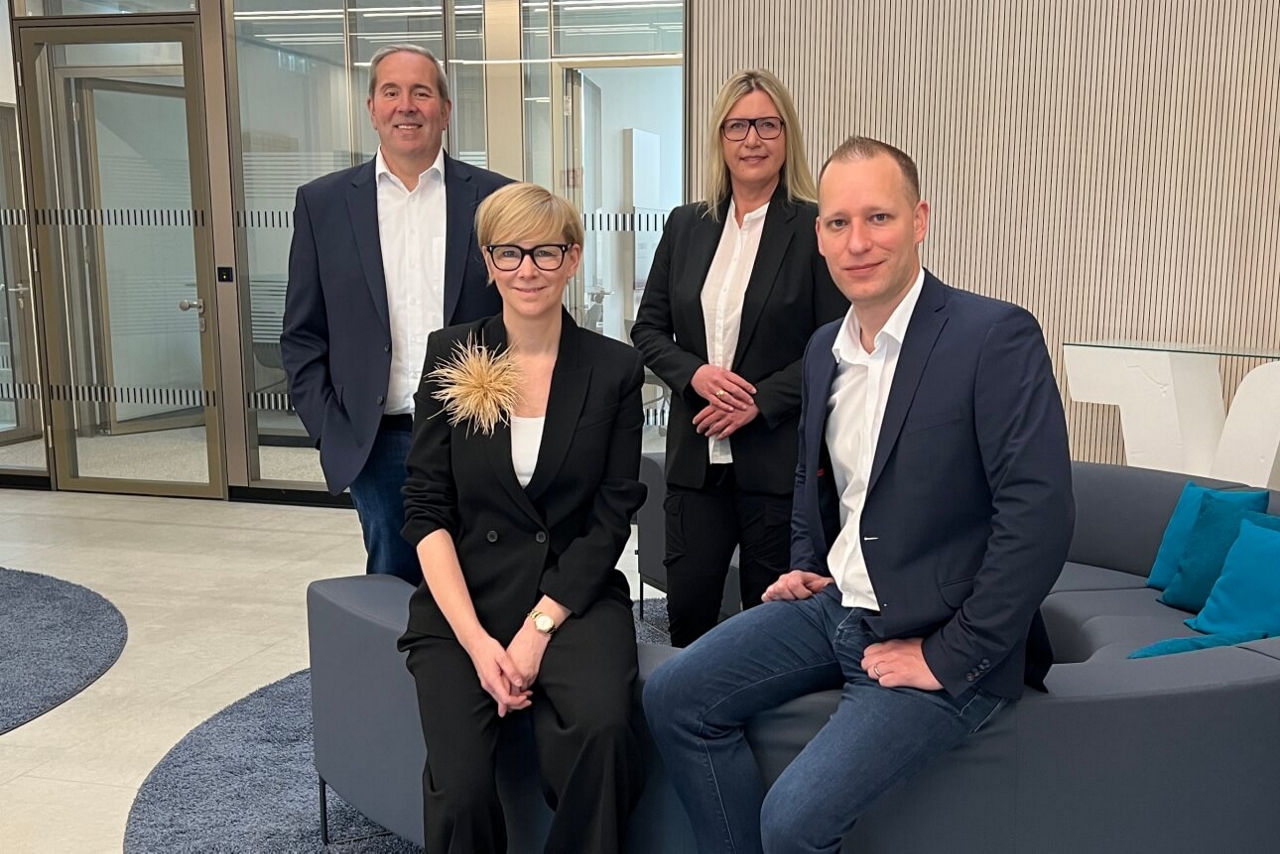 Teambild der gewerblichen Immobilienfinanzierung bestehend aus vier Leuten