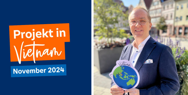 Mann mit Vietnam-Schild in der Hand