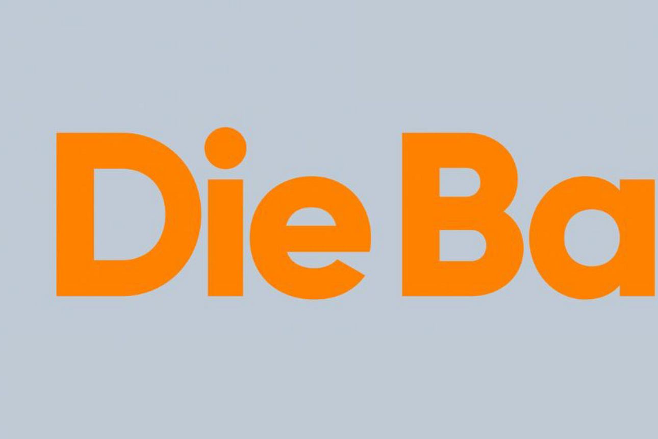 Grauer Hintergrund mit orangenem Schriftzug "Die Bank."