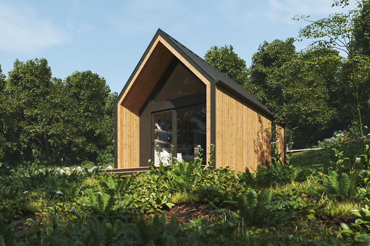 Tiny House aus Holt mit schwarzem Spitzdach in der Natur