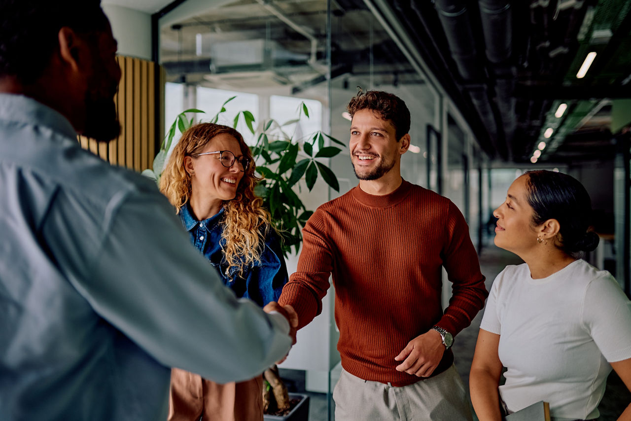 Business people shaking hands at office meeting