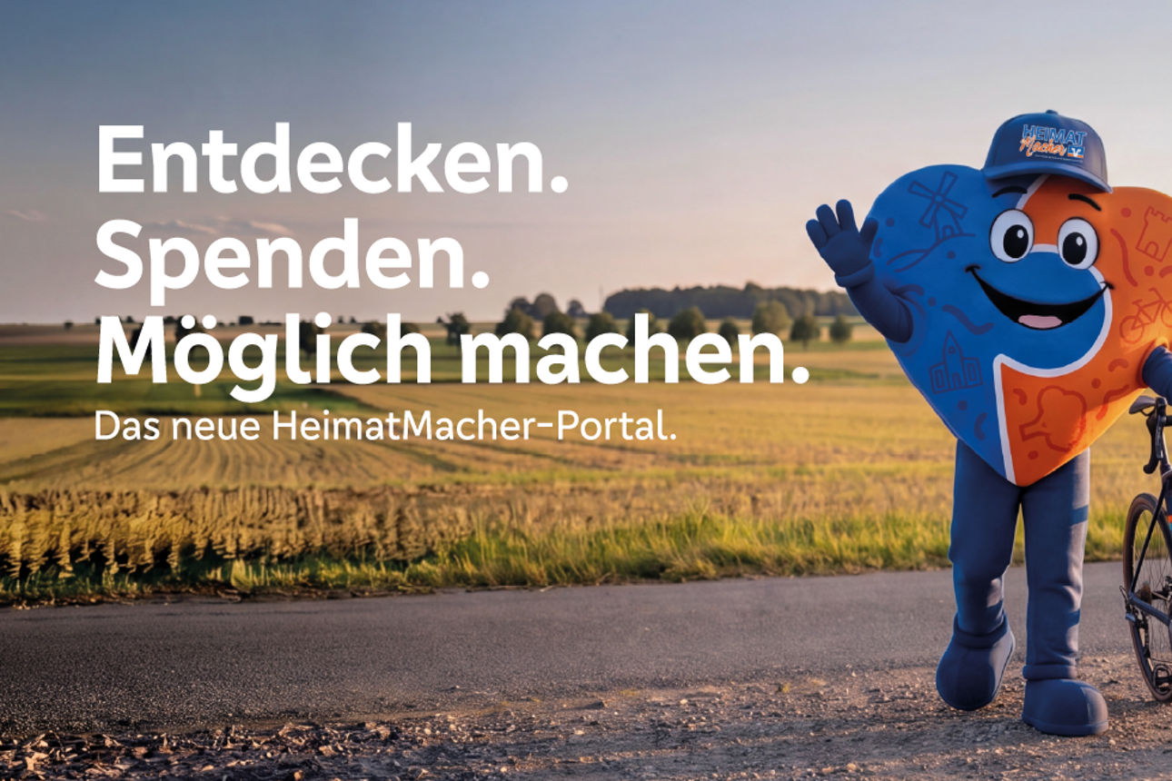 Maskottchen mit Fahrrad winkt dem Betrachter zu