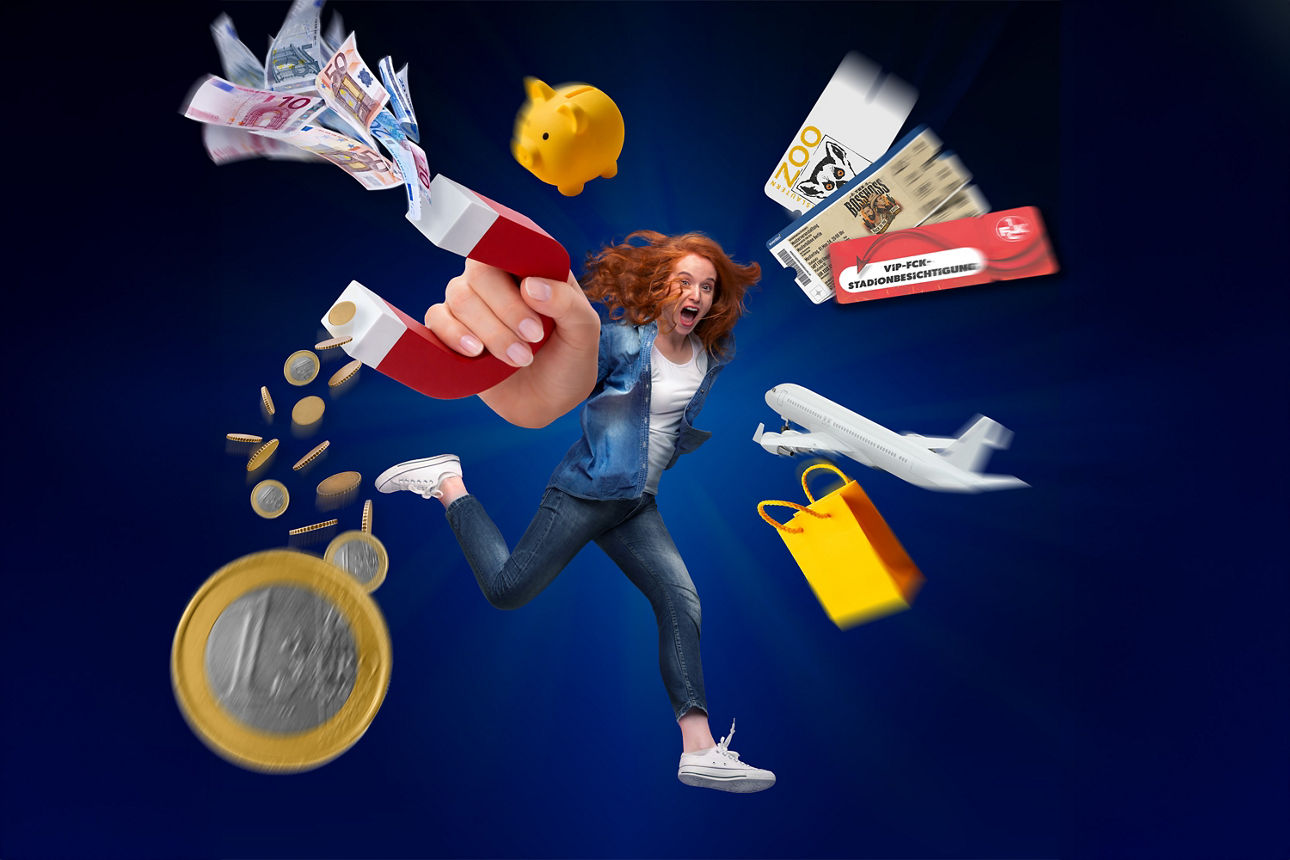 Junge Frau in Jeans rennt und hält in der Hand einen Magnet, der Geldscheine, Münzen, Veranstaltungstickets und weitere Mitgl