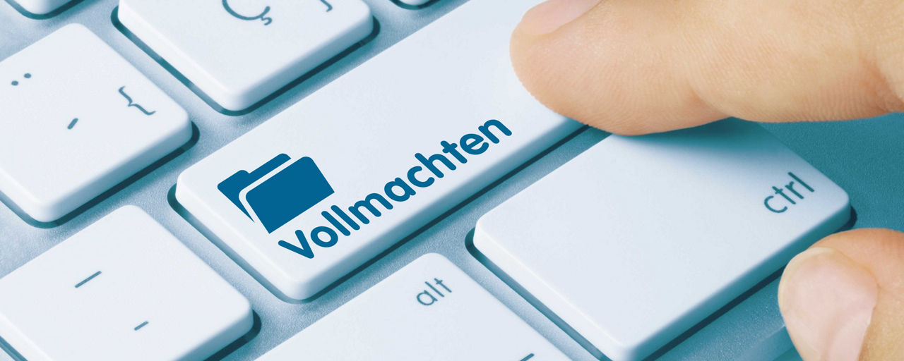Tastatur mit Finger auf der Taste Vollmachten