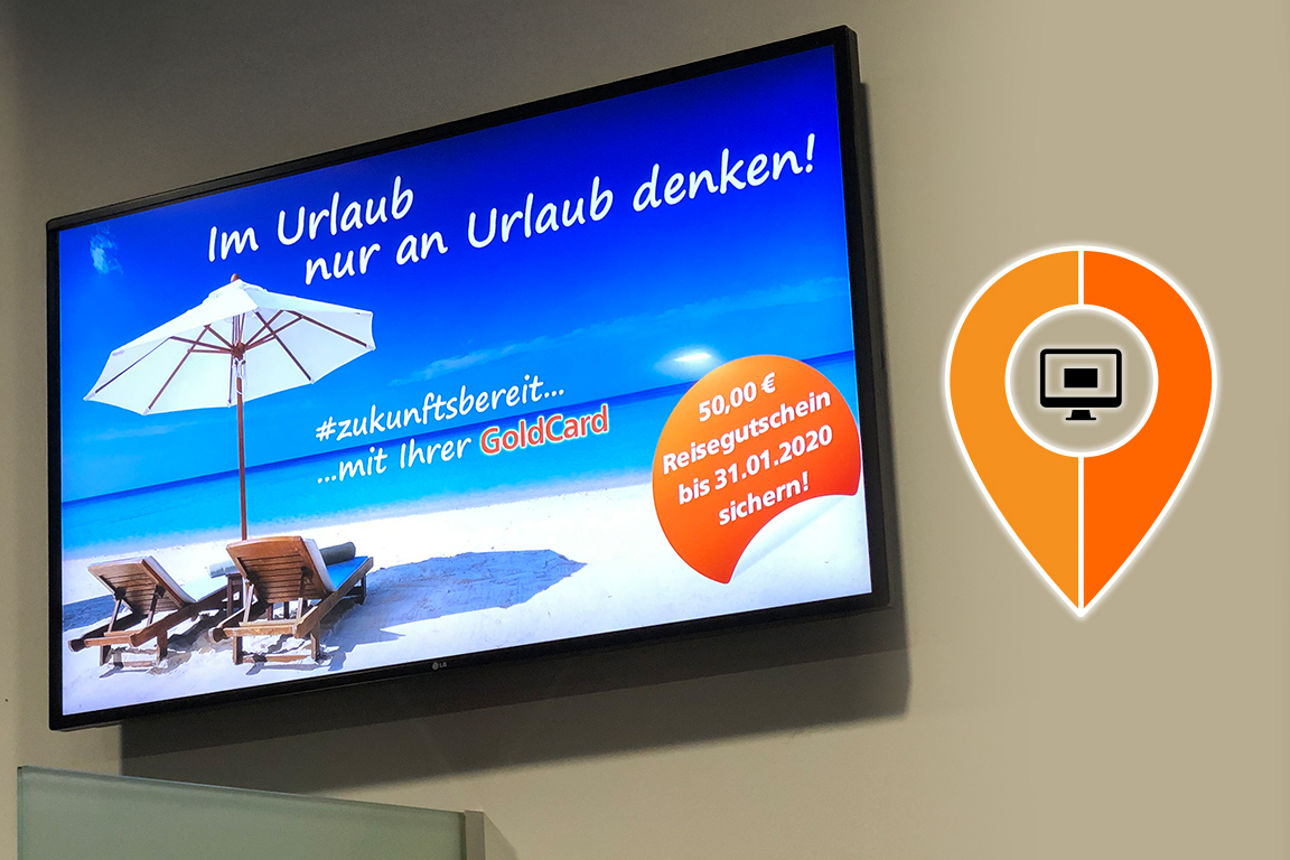 Zeigt mehrere Monitore mit Werbung