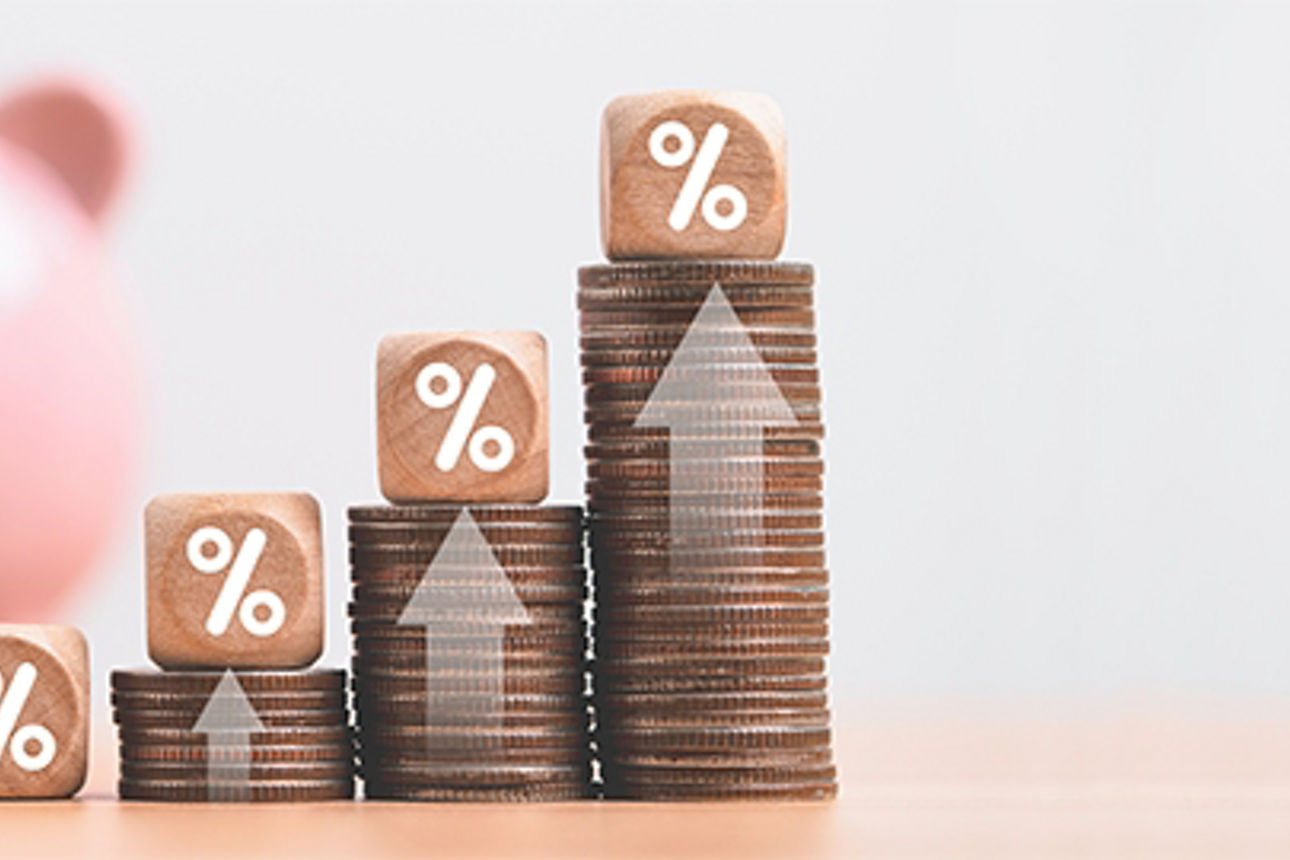 Increasing coin stacking with up arrow and percentage sign for increase financial interest rate and business investment growth from dividend concept.