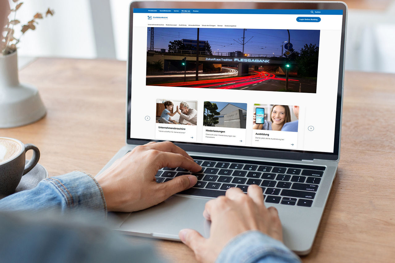 Ein Laptopdisplay auf dem die Flessabank-Internetseite zu sehen ist