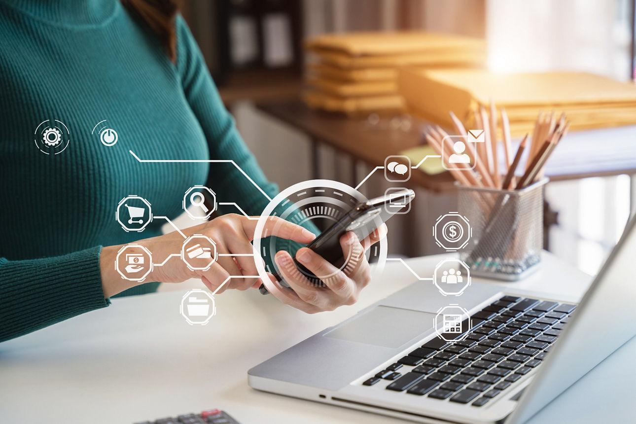 Businesswomen working with smart phone and laptop and digital tablet computer in office with digital marketing media in virtual icon.