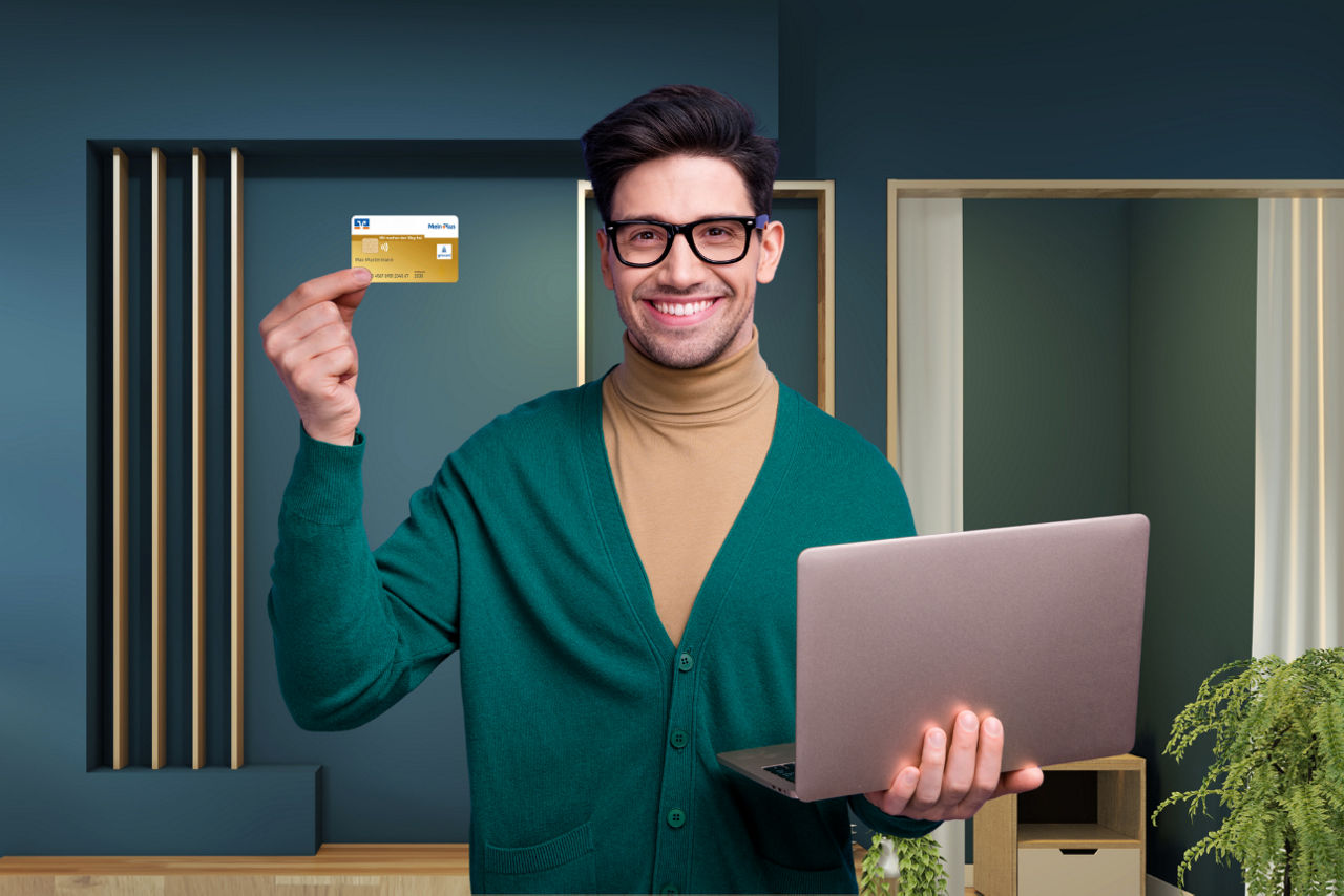 Neukunde hält girocard und Laptop – 50‑Euro‑Willkommensprämie für neues Konto bei der Volksbank.