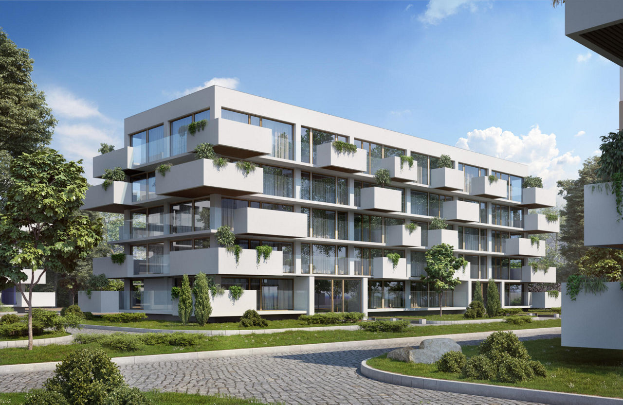 Ein modernes Mehrfamilienhaus mit viel grün an den Balkonen