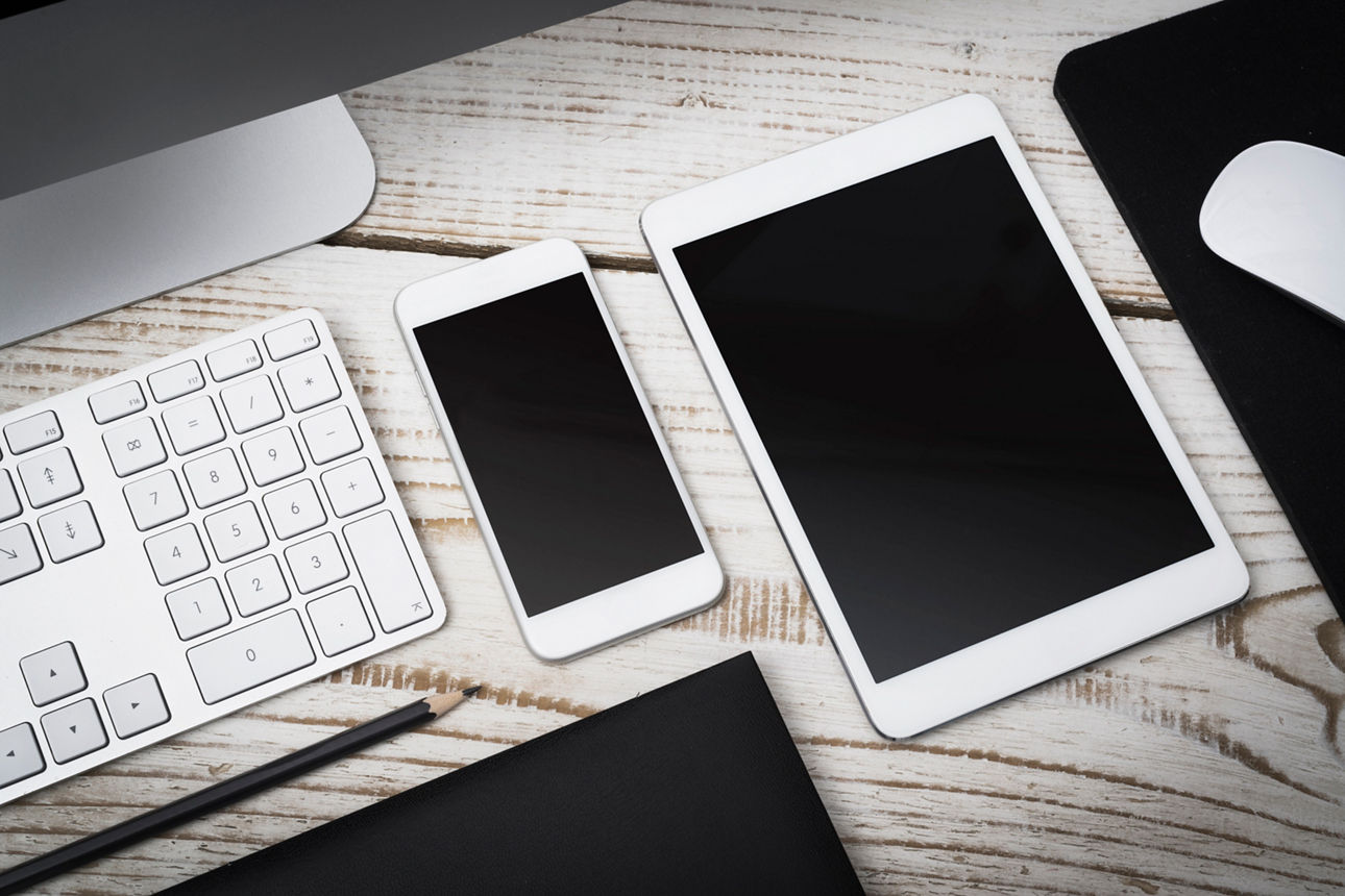 Smartphone and tablet pc side to side next to a computer for a responsive website concept