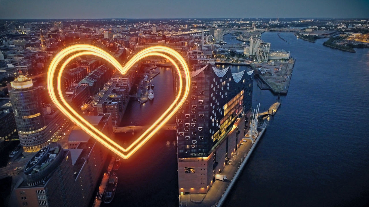 Unser MitmachZins 2025 - Eine Übersicht über Hamburg mit einem leuchtenden Herz
