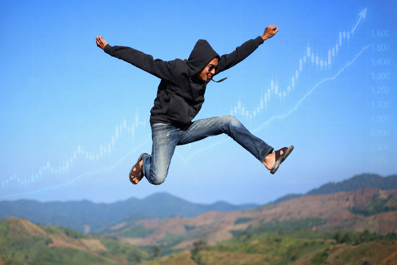 Springender Mann mit Aktiencharts