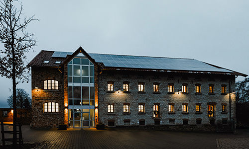Foto des Rautenschlein Bankhauses in Arbenddämmerung