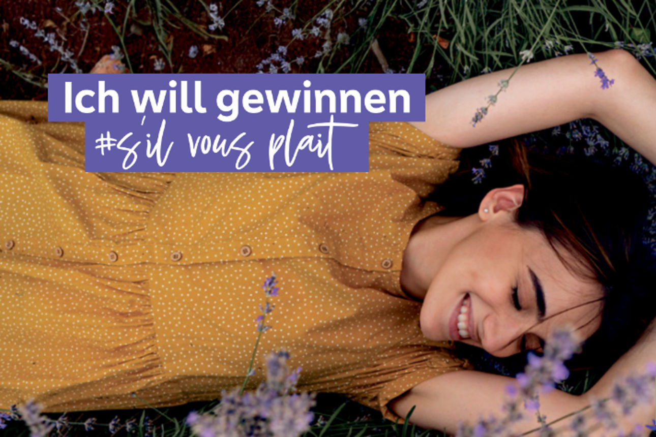 Text "Ich will gewinnen #s'il vous plait" mit Frau die in einer Blumenwiese liegt