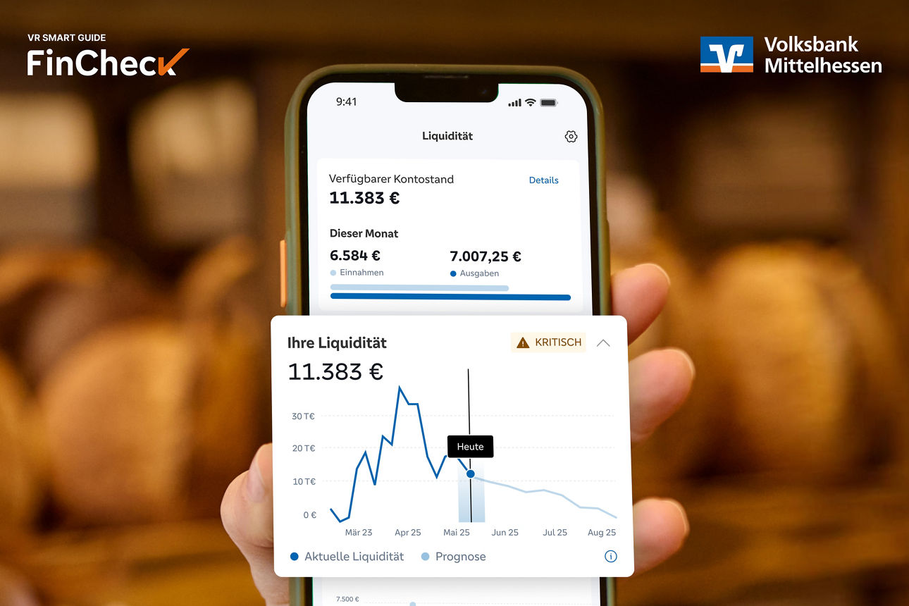 Handy wird in die Kamera gezeigt mit einer Grafik