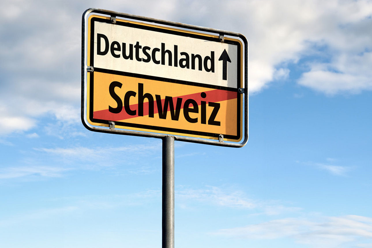 Ortschild mit der Aufschift Schweiz und Deutschland